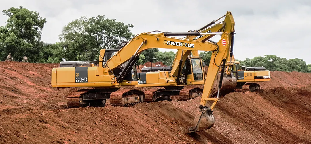 POWERPLUS PP220E-XI excavator loading a dump truck